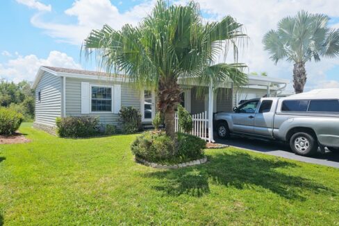 Tropically landscaped double-wide home with golf course view at 1263 Las Brisas LN, Winter Haven, FL