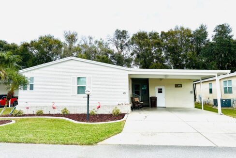 High quality Palm Harbor Home (Tan with white trim) at 4736 Crestwicke DR, Lakdland, FL
