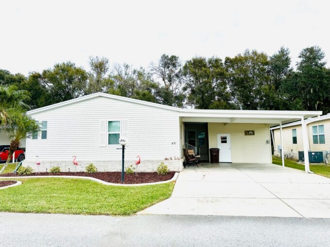 High quality Palm Harbor Home (Tan with white trim) at 4736 Crestwicke DR, Lakdland, FL
