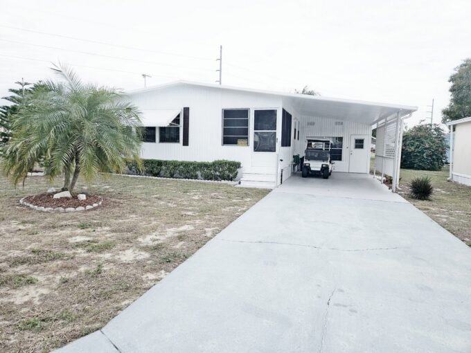 Welcome Home to 72 Juniper Drive W, Dundee, Florida...White home with long driveway