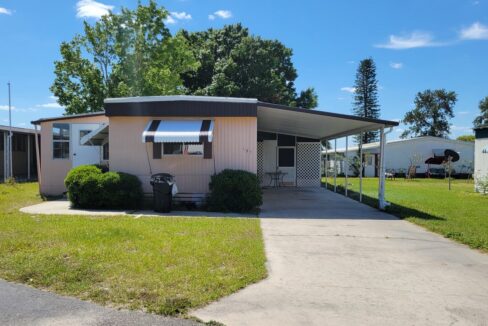 Affordable Renovated Getaway at 191 Rainbow LN W, Dundee, Florida. Single-wide home w/2 lanais and covered carport in lakefront community.