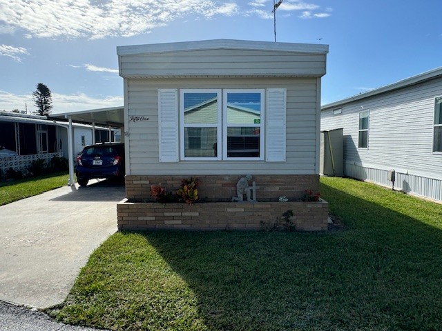 Charming two bedroom, one bath waterfront home with exclusive access to the renowned Chain of Lakes in Winter Haven, Florida. Private driveway, carport, shed, lanai and back patio with access to the canal.