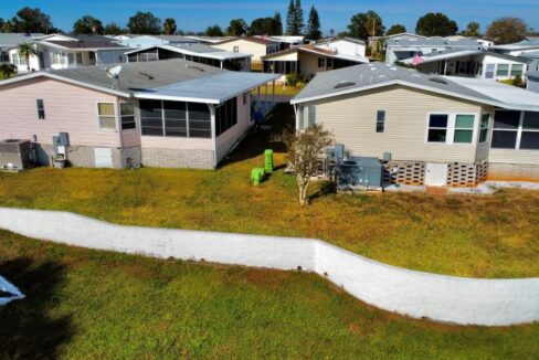 10 - Back of house with retaining wall