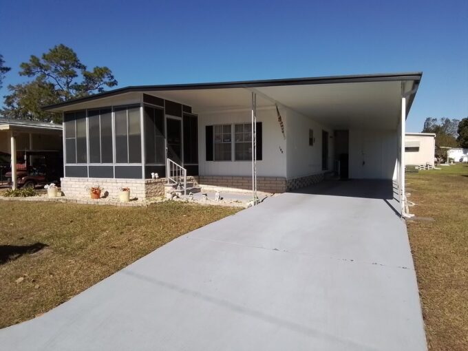 Private driveway, carport, storage shed, lanai, with 2 bedrooms and 2 bathrooms.