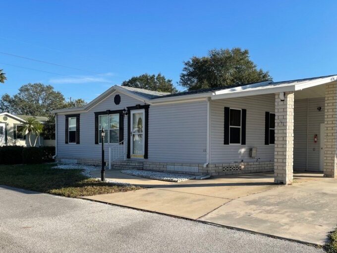 Double driveway, carport, storage shed.