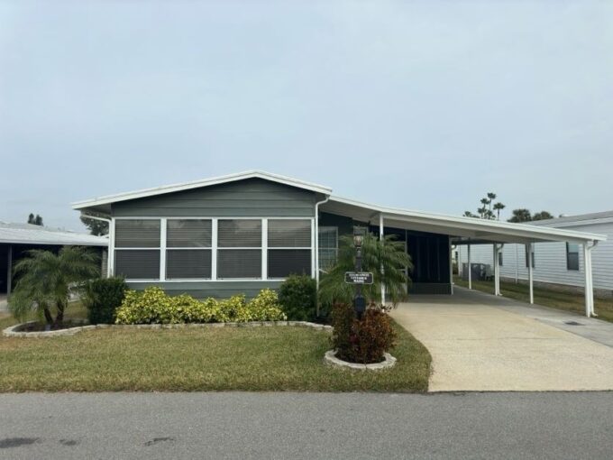 This home is a modern treasure, with over 1200 sq ft, 2 bedrooms, 2 updated bathrooms, 150 sq ft Florida room open to living room, 204 sq ft screen enclosed lanai, 272 sq ft storage shed/workshop/golf cart garage/laundry room, NEW 2023 roof w/30 yr warranty, 2023 Electrical System Update w/GFI breakers/outlets & 10 yr warranty, 2023 HVAC, 2023 HW Tank, PVC Plumbing, 2022 SS kitchen appliances, 2023 extended 2 car-carport w/side-by-side parking, exterior home painted 2023, 2023 waterproof LVP flooring throughout and more.