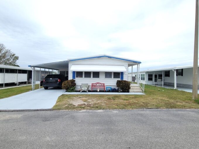 Private backyard with Orange Grove views. This partially furnished, 2-bedroom, 2-bath, Double-wide welcomes you with a wonderful covered front door entrance into this 1977 mobile home featuring 1440 sq. ft. Private driveway, carport, storage shed, lanai.