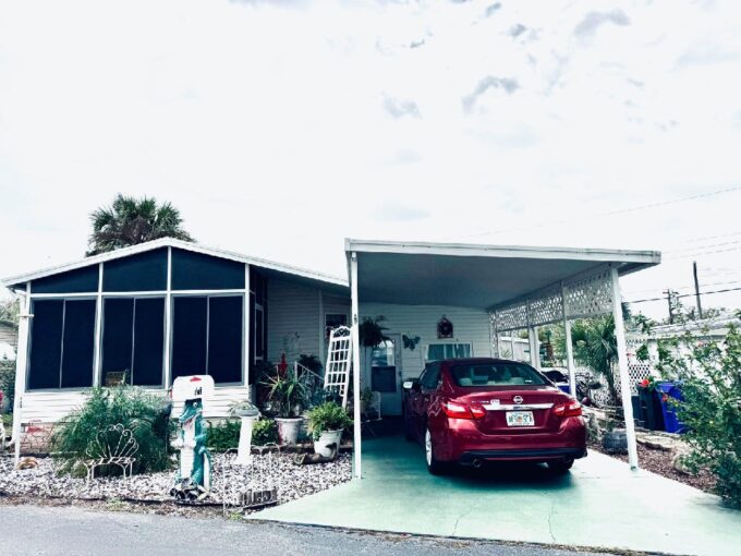 Private driveway, carport, gutters, two lanais and storage shed.