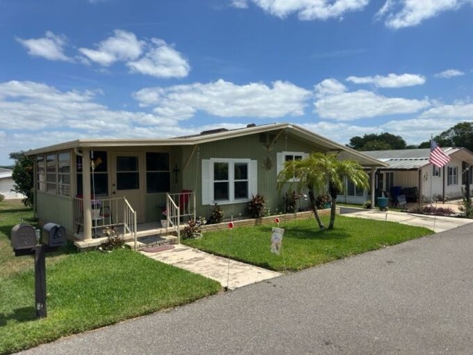 This well cared home is where you’ll enjoy a bright welcoming nearly 1014 sq ft dwelling, with two bedrooms, two bathrooms, a cleverly designed kitchen with tremendous amounts of cabinets-drawers-pantry space, dining room with mirrored built-in display cabinet, living room, Florida room with tinted glass-screen enclosed swing out windows, a covered front porch, breezeway access to the backyard and paved patio, and laundry/storage room with utility sink and work bench.