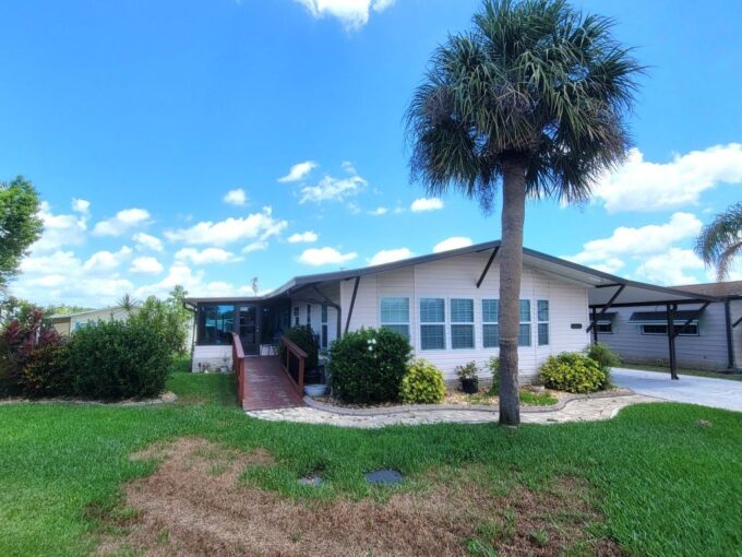 Prepare to be IMPRESSED by this spacious, FULLY FURNISHED 1985 Double-Wide home, offering 1,684 sq. ft. of THOUGHTFULLY DESIGNED living space. Situated on an OVERSIZED LOT with a stunning, PARK-LIKE side yard, this property is IDEAL for both RELAXATION and entertaining — and yes, the GOLF CART is INCLUDED!