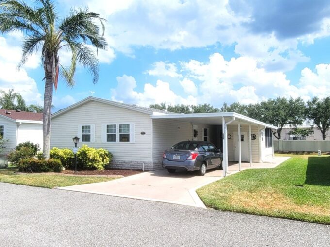 Private driveway, carport, storage shed, lanai on perimeter lot.