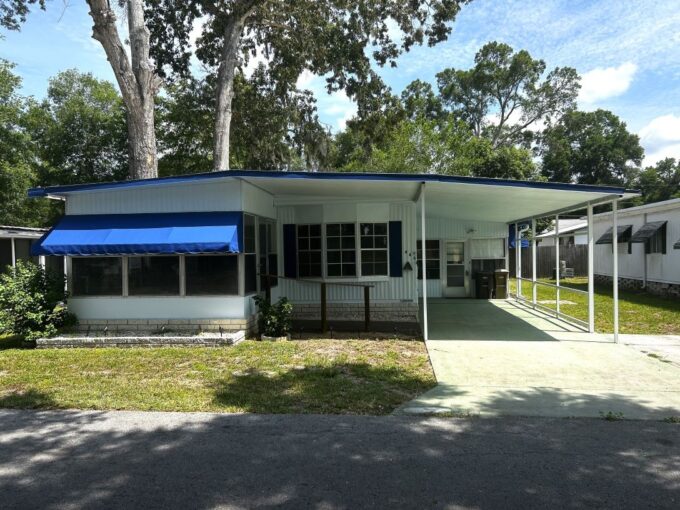 Private driveway, awnings, carport, storage shed, 2 lanai's, Offering 2 bedrooms and 2 bathrooms, this cozy residence features everything you need for easy living-plus a bonus Florida room that adds versatility and extra square footage to enjoy all year round.