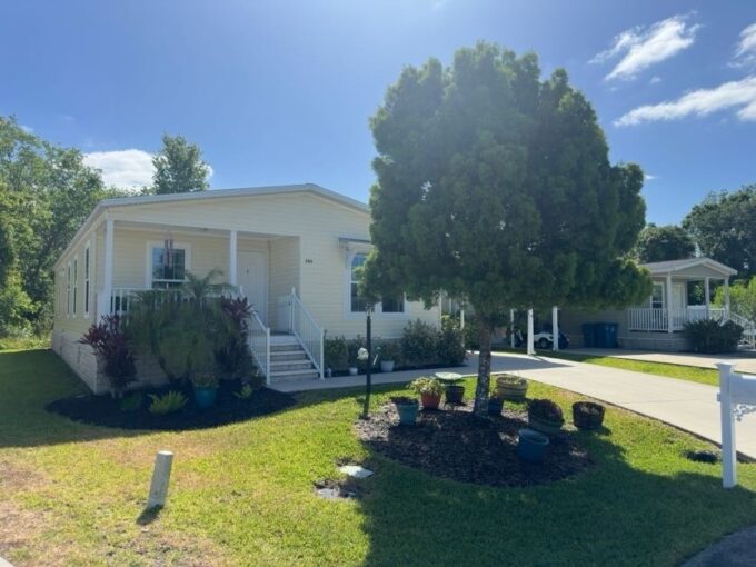 This home is on a perimeter lot backed to a nature preserve boasting of approximately 1568 sq ft, two bedrooms w/den-office or third bedroom with two full bathrooms, eat-in kitchen with stately kitchen island/breakfast bar, living room, interior laundry room, newer Luxury Vinyl Plank flooring in main living quarters/baths, easy clean double pane tilt sash windows w/screens, 2-4 car driveway w/carport, shed, covered front porch, and a beautifully landscaped yard with programmable irrigation system.