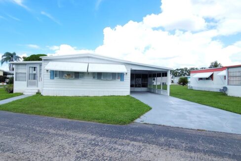 Corner lot, private driveway, lanai, screened rooms, storage shed, gutters, metal roof, awnings.