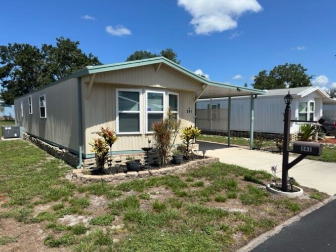 Split Floor Plan Double Pane Windows Kitchen Pantry 2023 Hot Water Tank Metal Roof 2018 Screened Lanai 13 x 11 Inside Laundry Covered Carport + Storage Shed