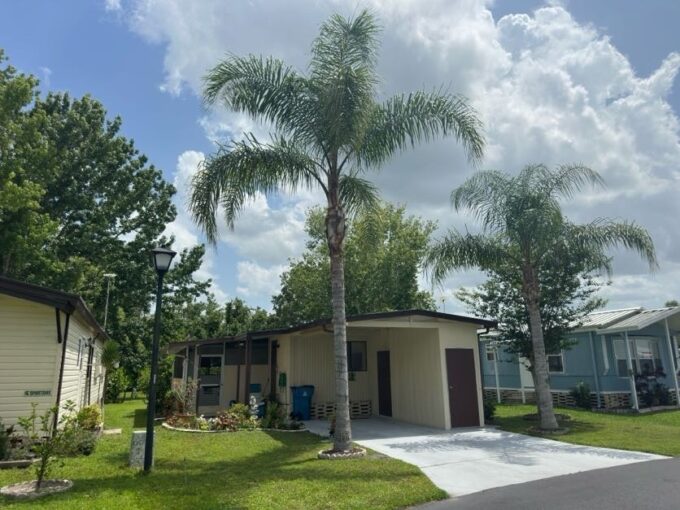 Perimeter lot, private driveway, carport, lanai, storage shed, gutters, awnings.