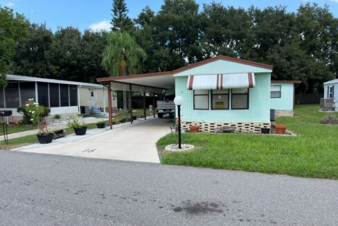 This home comes furnished and offers 1056 sq ft, split floor plan, 2-bedroom, 2-bathroom, eat-in kitchen with built-in buffet/butler pantry, the living room with built-in hutch & wall entertainment center with a walnut finish, interior laundry room, and LVP that flows throughout all rooms except the bedrooms and Florida Room 12 x 9.