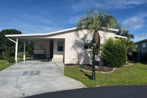 This home is on a cul-de-sac, private driveway, carport, wheelchair ramp, golf cart garage, lanai and on the golf course.