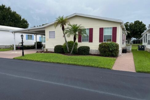 This thoughtfully designed residence seamlessly blends comfort with entertainment space. Begin each day in the air-conditioned, glass enclosed lanai, where you can savor your morning coffee while watching the golfers perfect their swing! Private driveway, carport, golf cart garage, 4 season room plus it comes furnished.