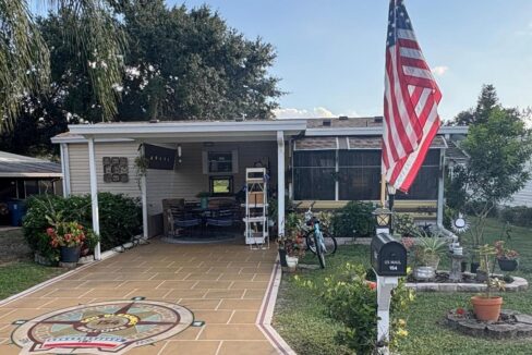 This home has a decorated driveway, carport, lanai, storage shed, 2 bedrooms, 2 bathrooms, walk in closets, kitchen with an island and pantry. Being sold fully furnished.