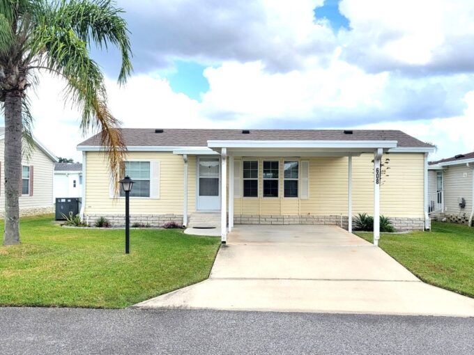 OPEN-CONCEPT DESIGN. You’re greeted by the BEAUTIFUL TILE DETAIL on the breakfast bar base and kitchen backsplash — a perfect blend of style and charm. This 2006 DOUBLE-WIDE offers 1,080 SQ. FT. of comfortable living space with a SPLIT-BEDROOM LAYOUT — 2 BEDROOMS, 2 BATHS — positioned on opposite sides for added PEACE AND PRIVACY. INTERIOR UPGRADES… OWNER’S EN-SUITE BATHROOM – Remodeled (2024) FLORIDA ROOM – Completed (2021) with new MINI-SPLIT HEAT & AIR (2025) ROOF – SHINGLE (2021) DISHWASHER (2021)